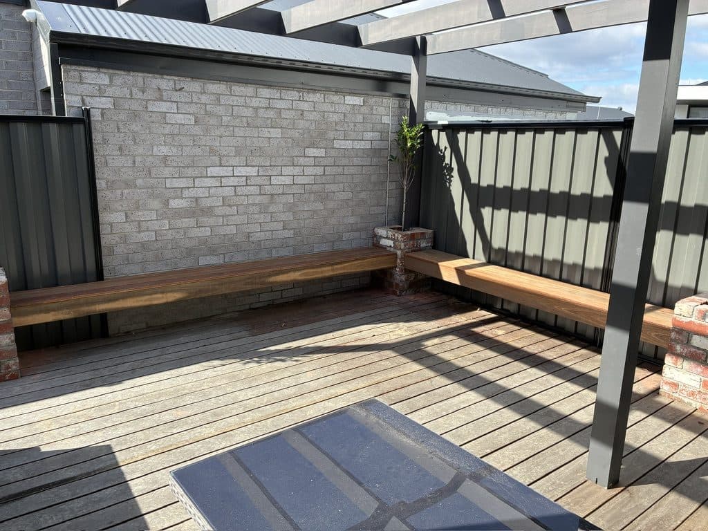 The alfresco before the screens, with bench seats along the wall