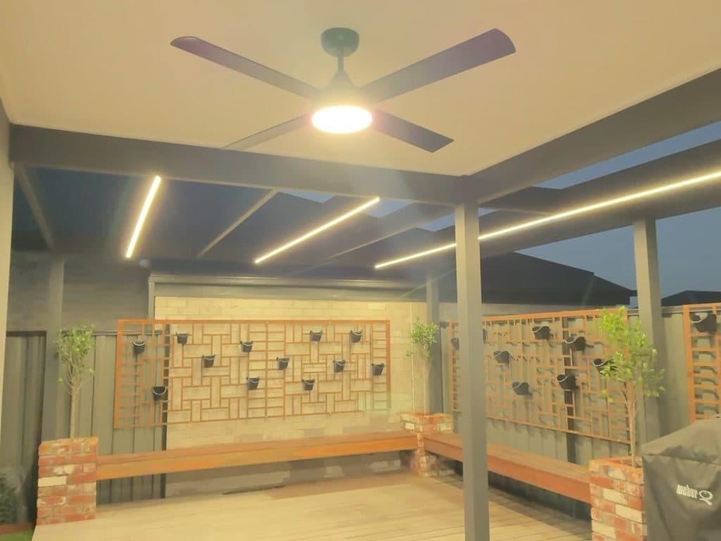 Warm light on the screens and benches