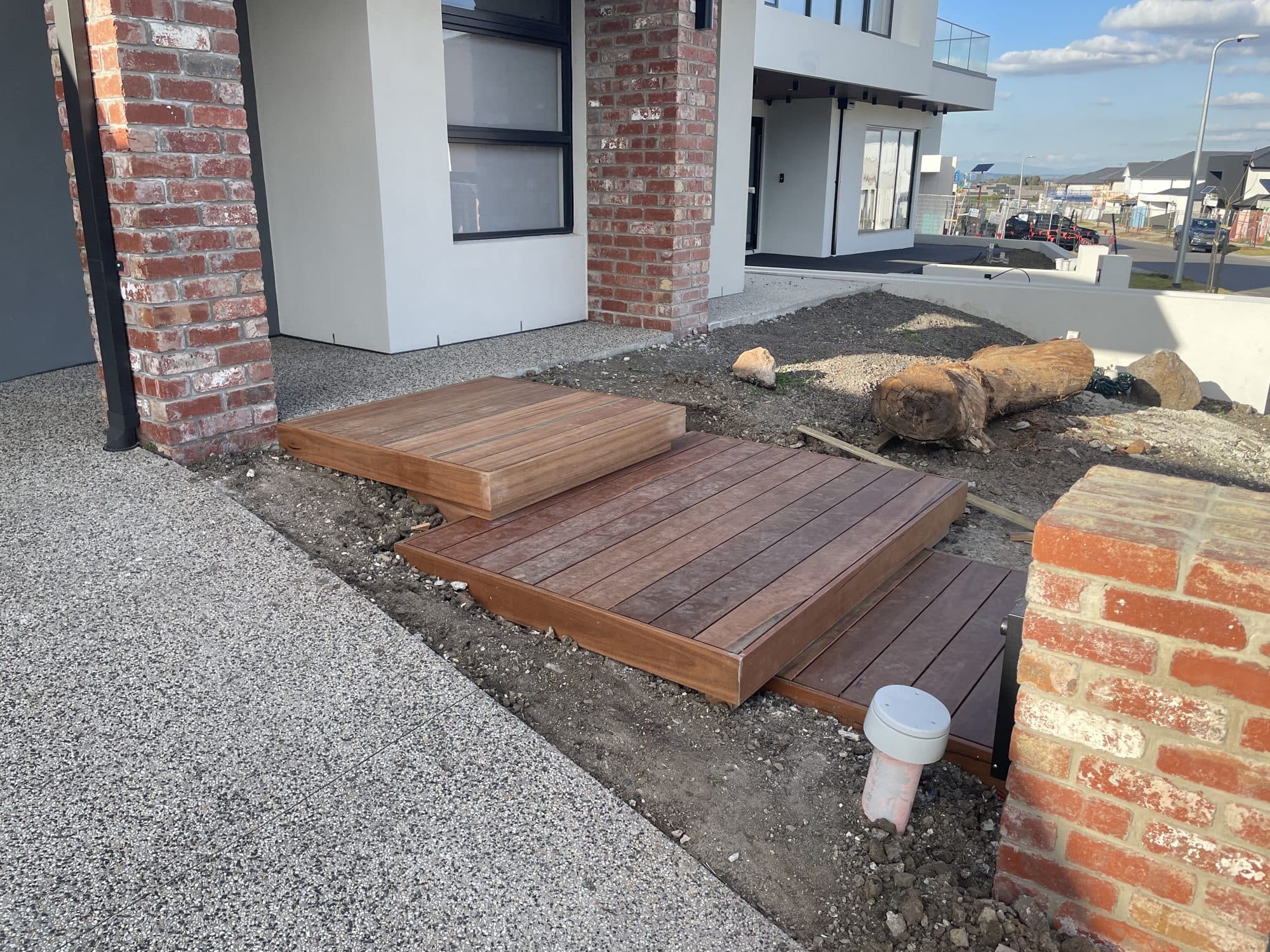 Floating merbau steps under construction at the front entry