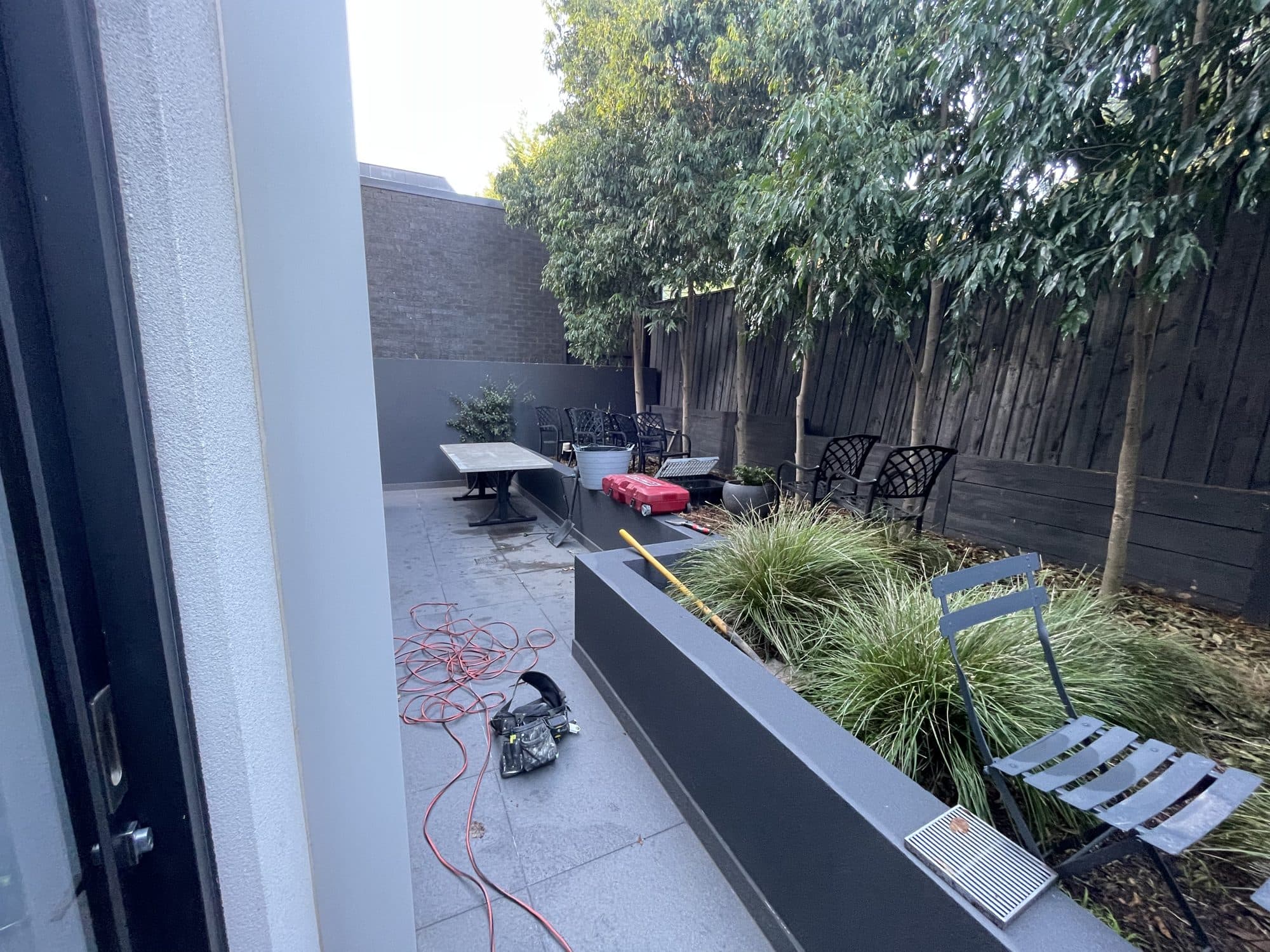 The courtyard and raised garden bed before the work