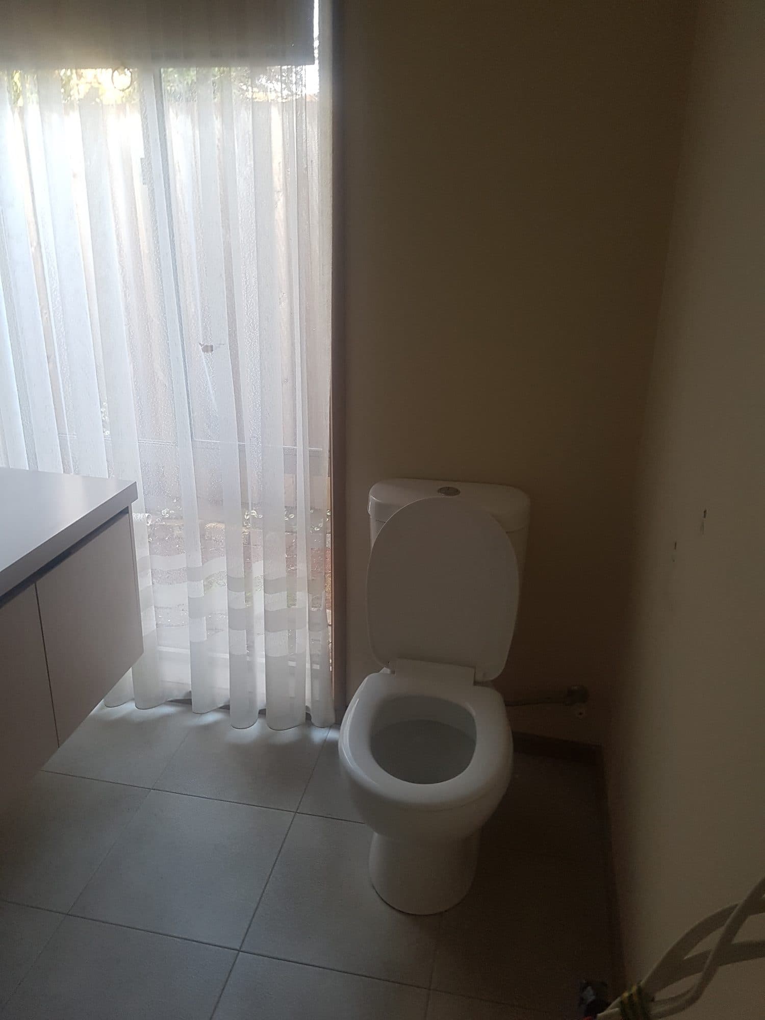 The old toilet beside the window