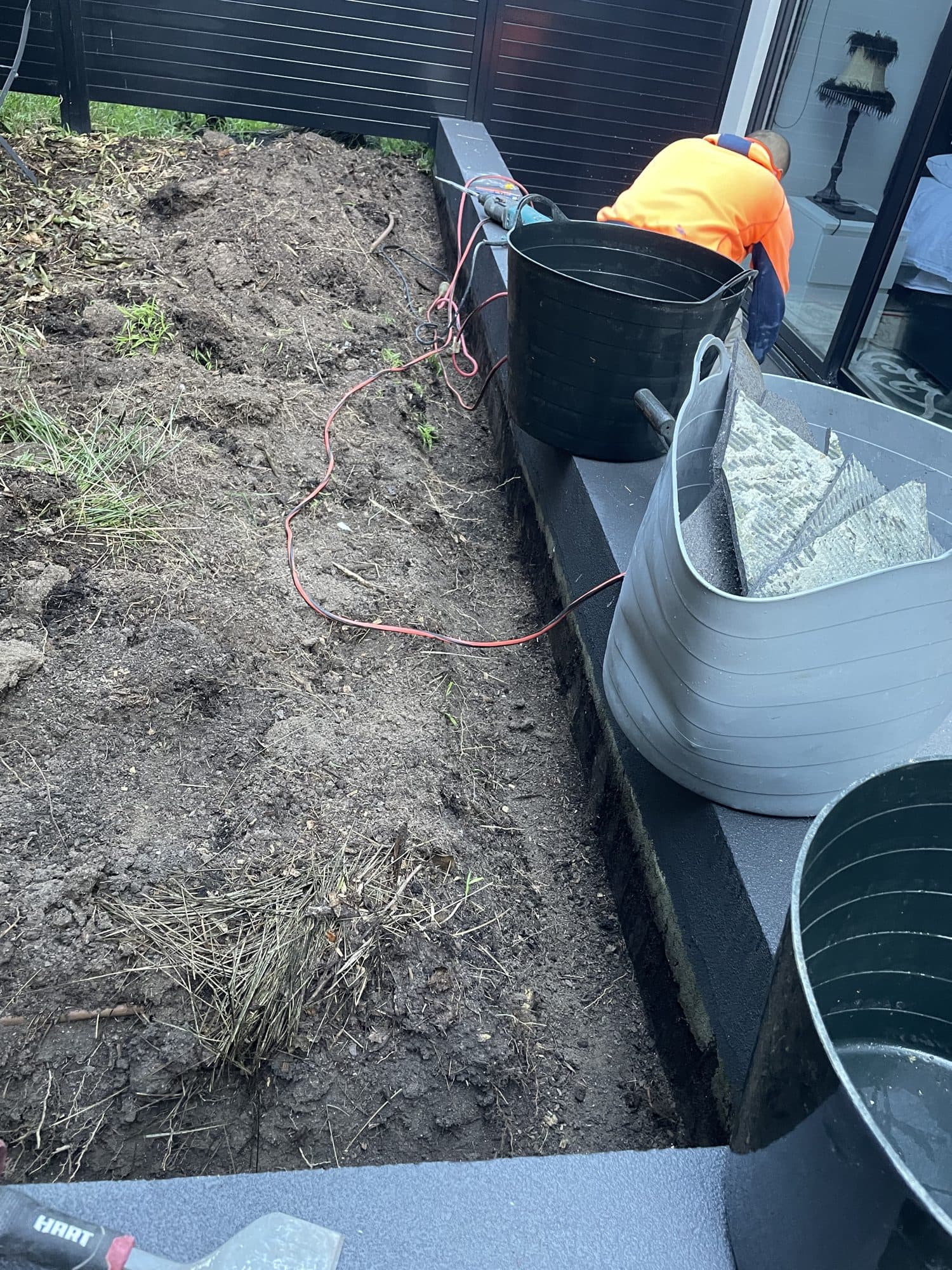 The raised garden bed being dug out