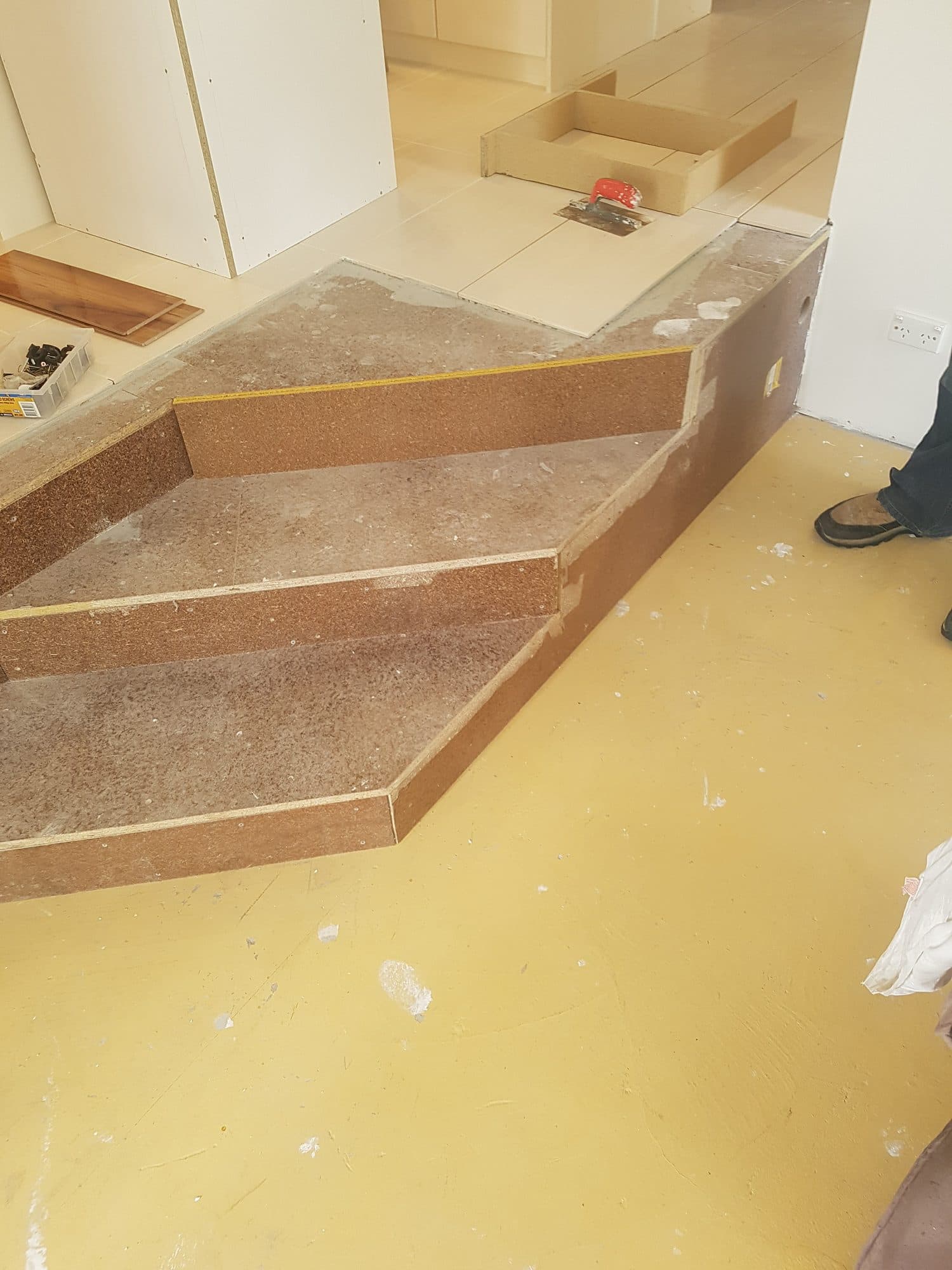 The angled steps sheeted and ready for tiling