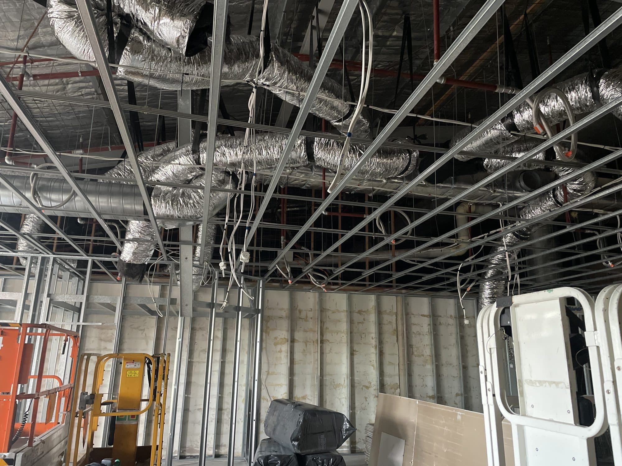 Suspended ceiling grid below the ductwork
