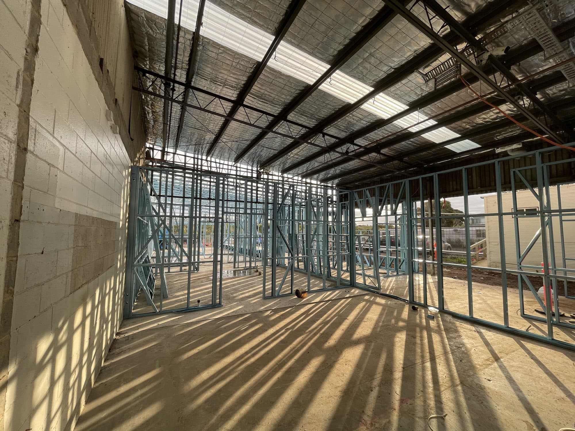 Steel stud framing along an existing block wall