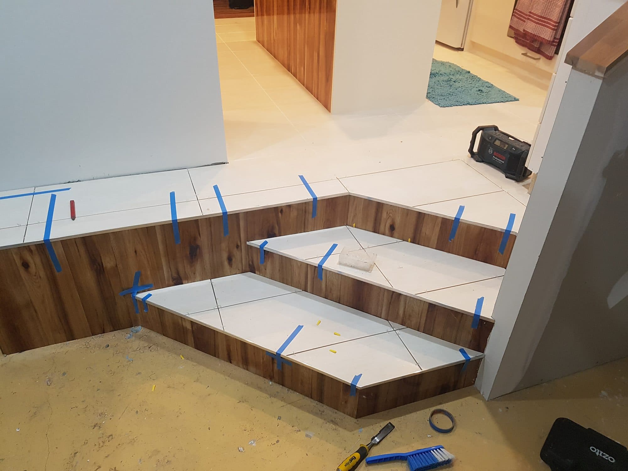 The steps with tile laid and spacers still in