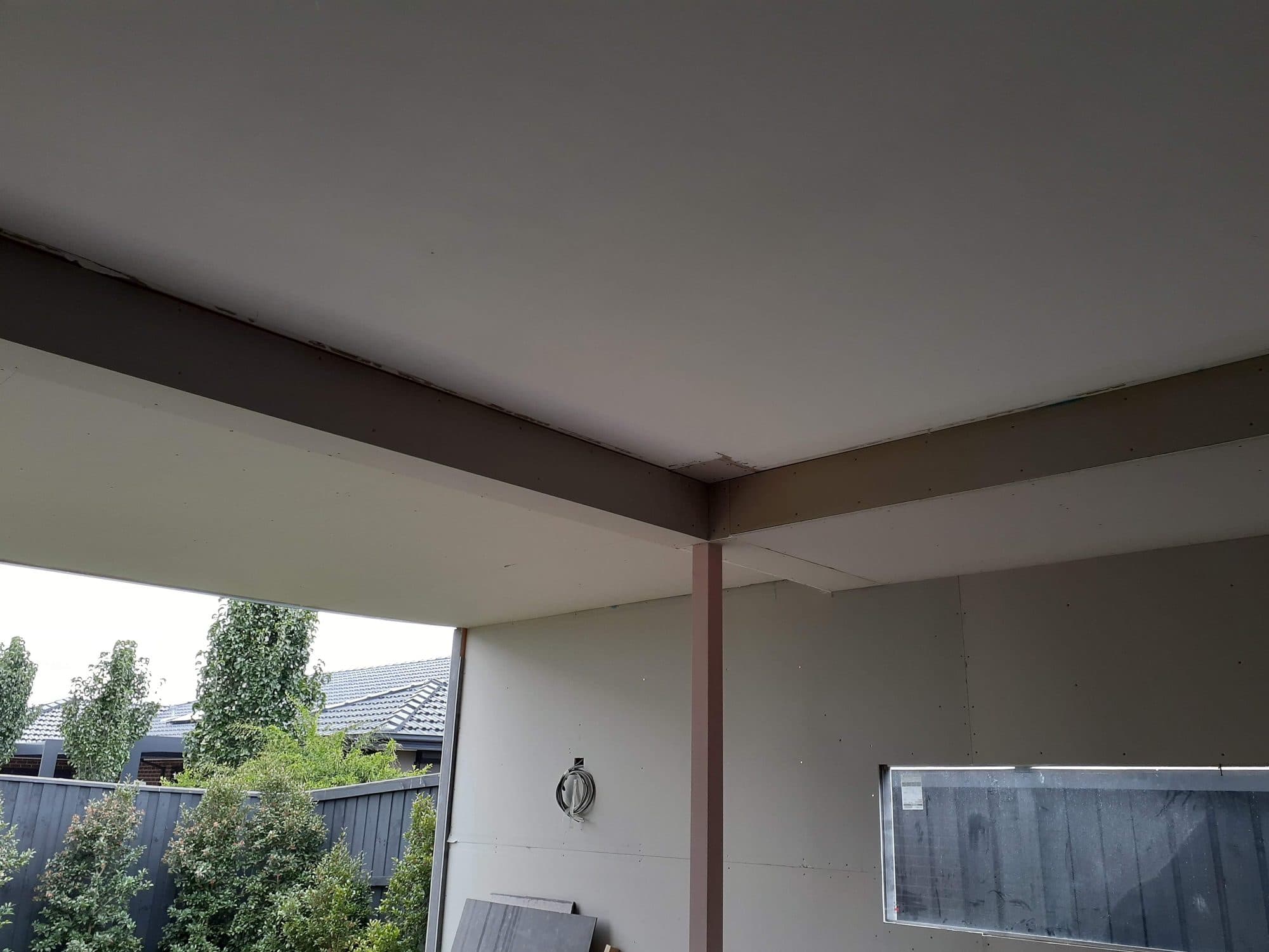 The lined ceiling and beams of the extended alfresco