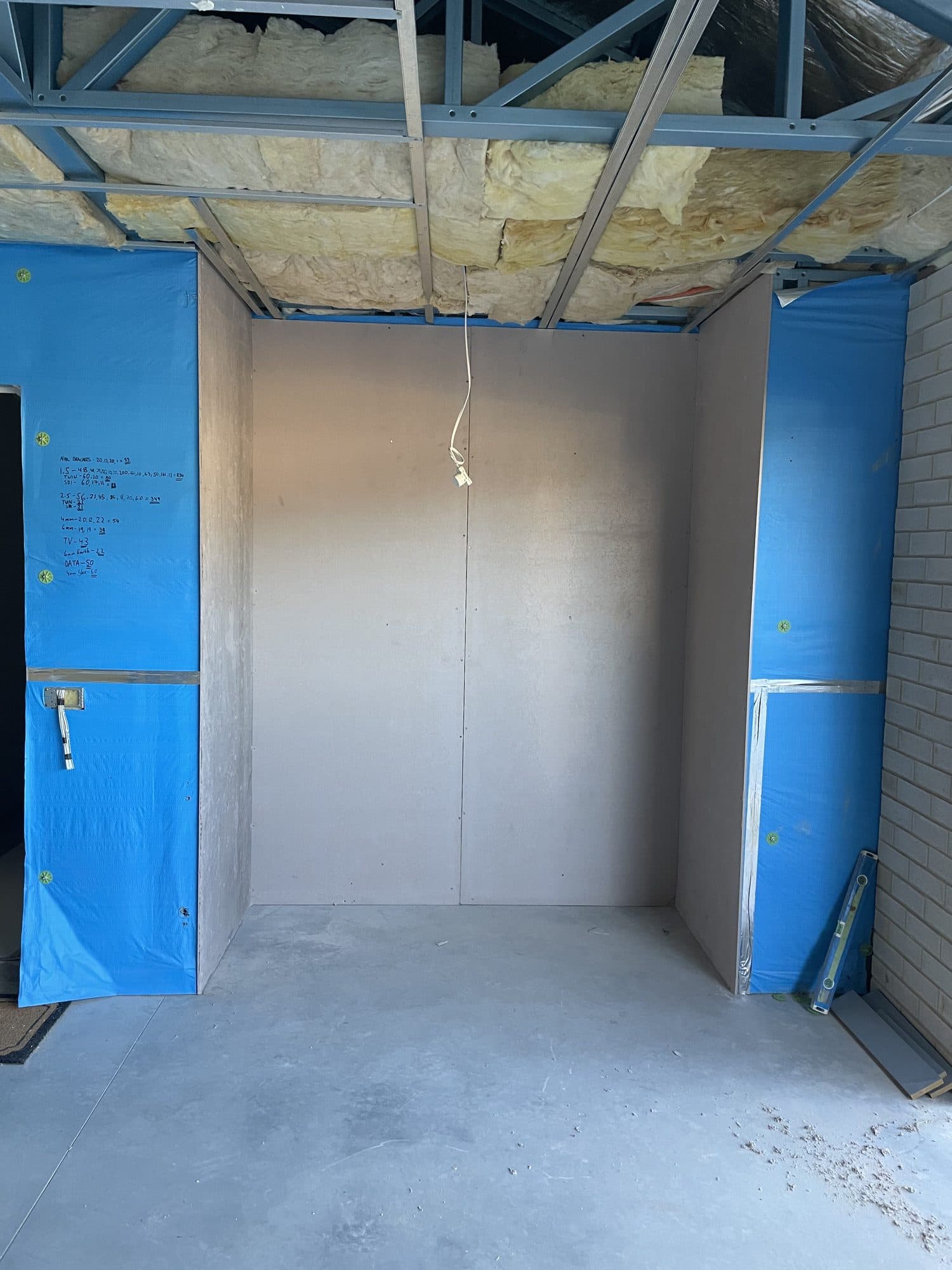 A wet area with walls lined and a waterproof membrane on the framing