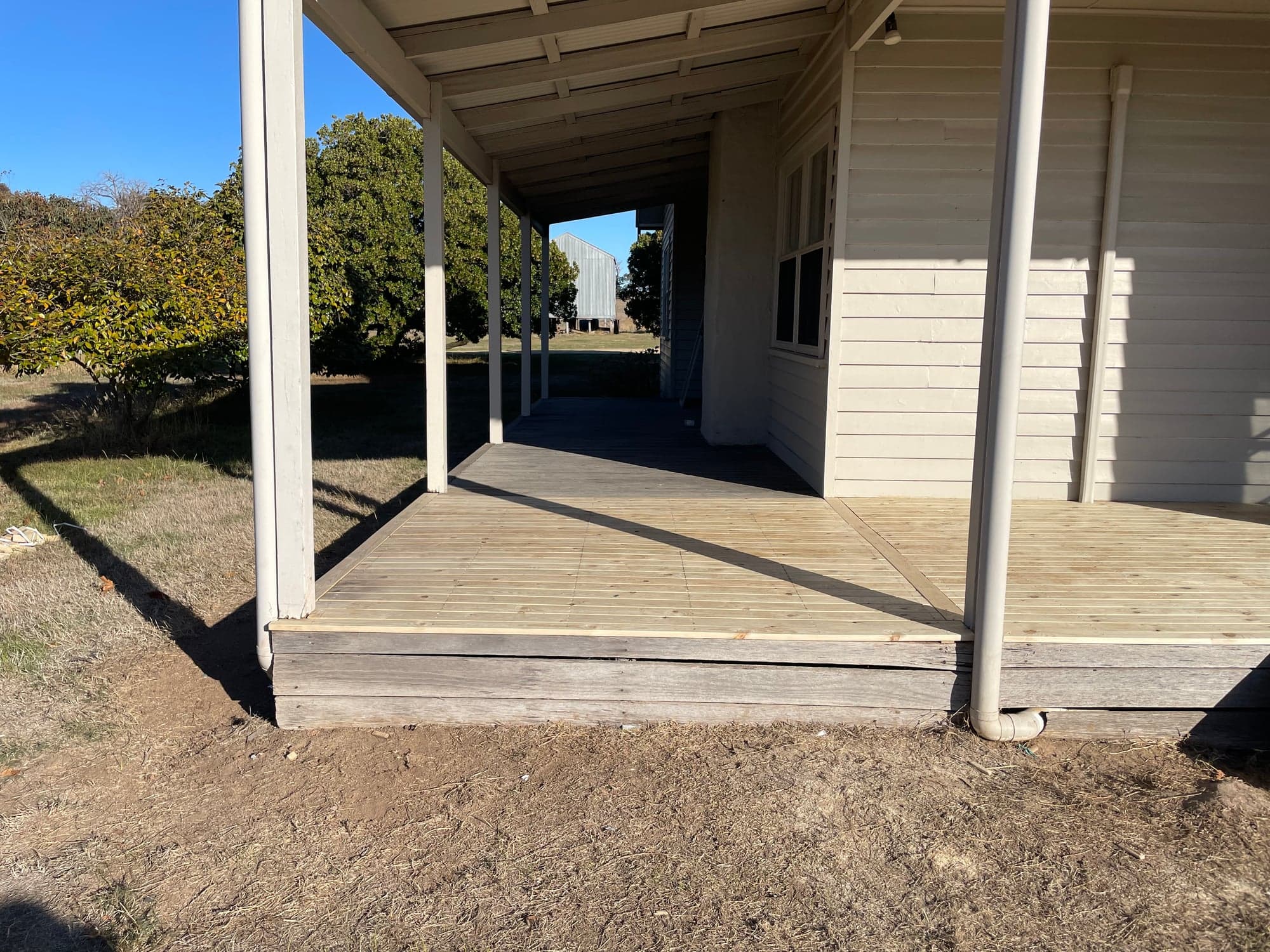 The new deck running the length of the verandah under its roof
