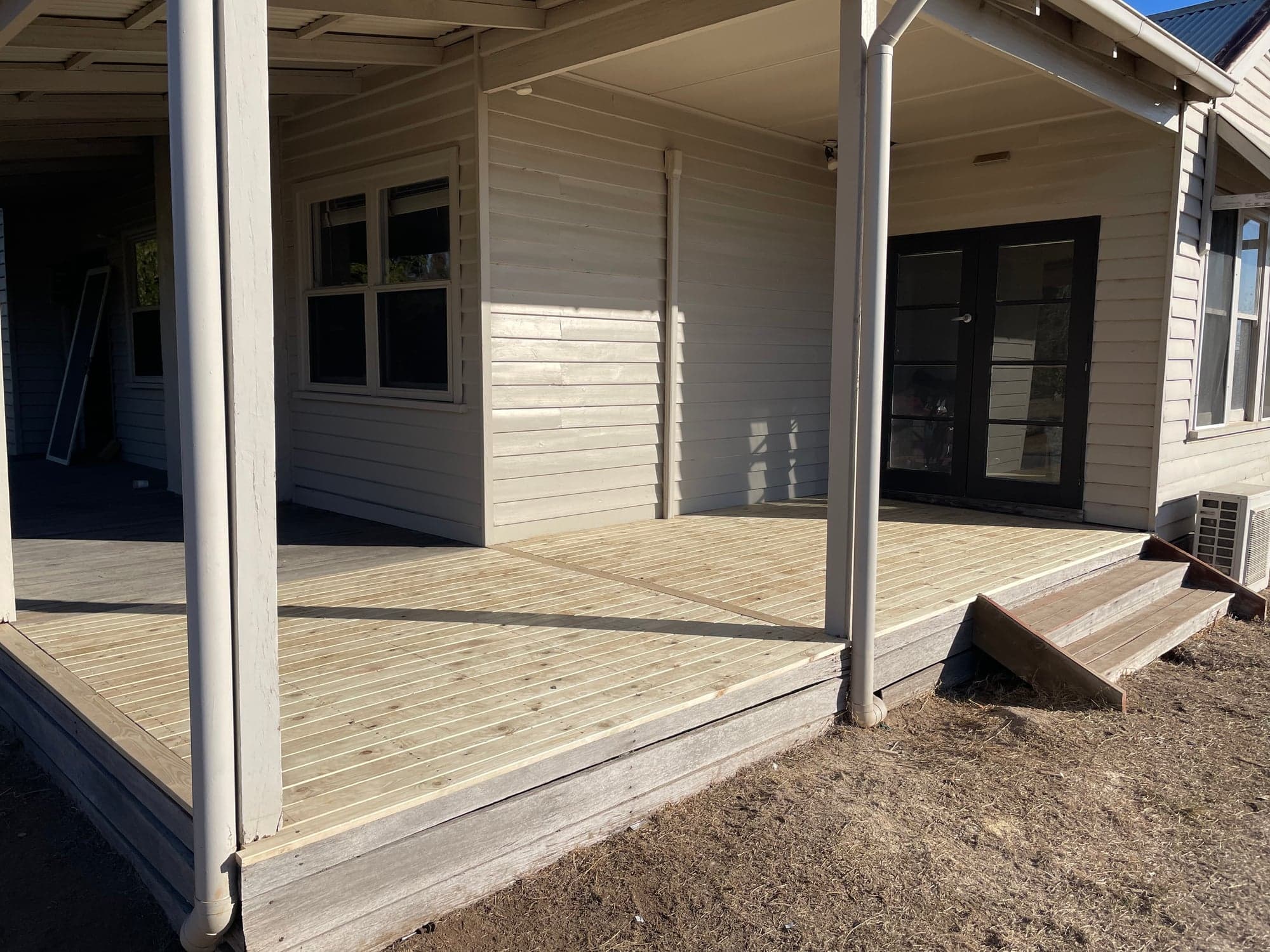 The new deck along the french doors at the end of the verandah